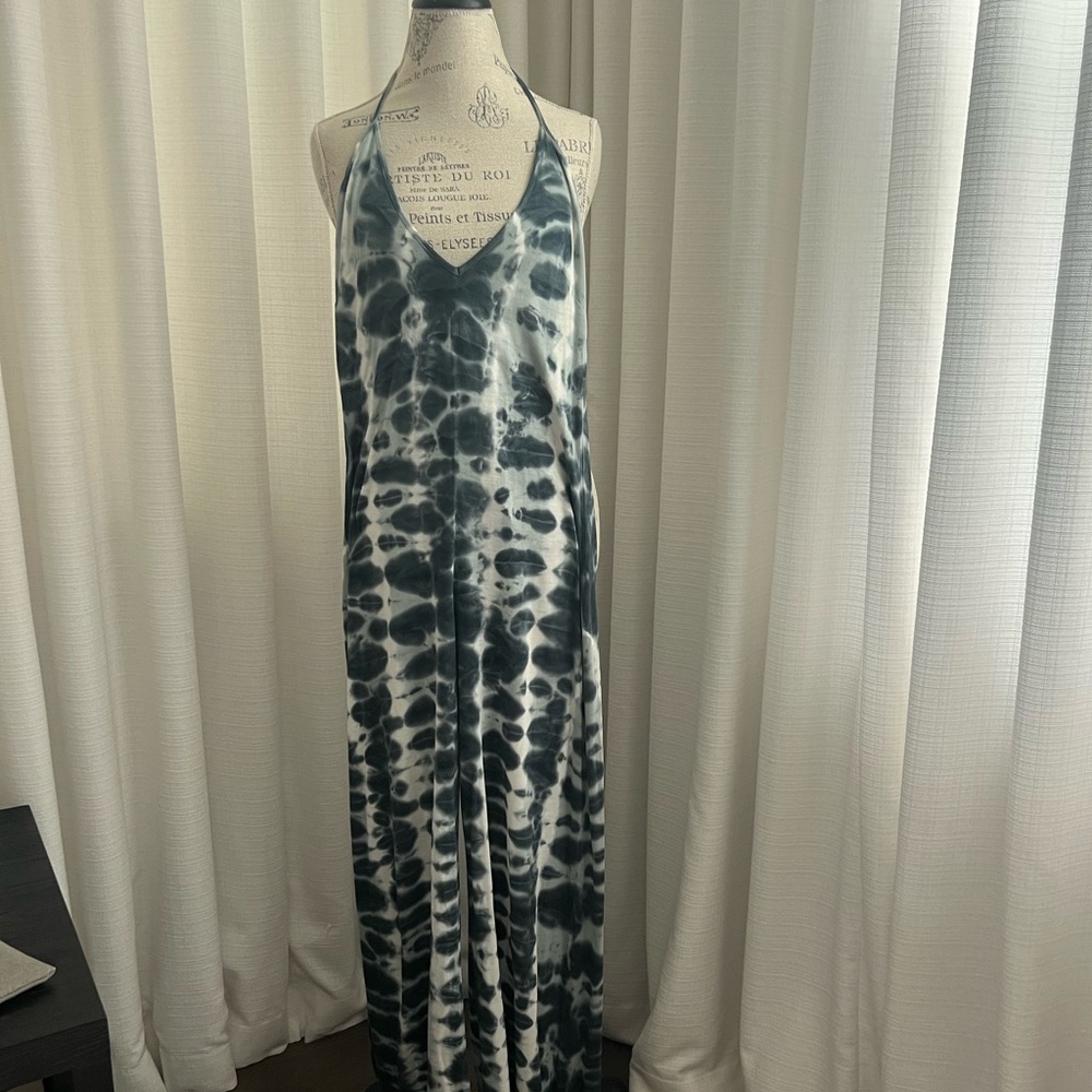 Jumper ankle length/halter with low back and built in bra. Size Medium